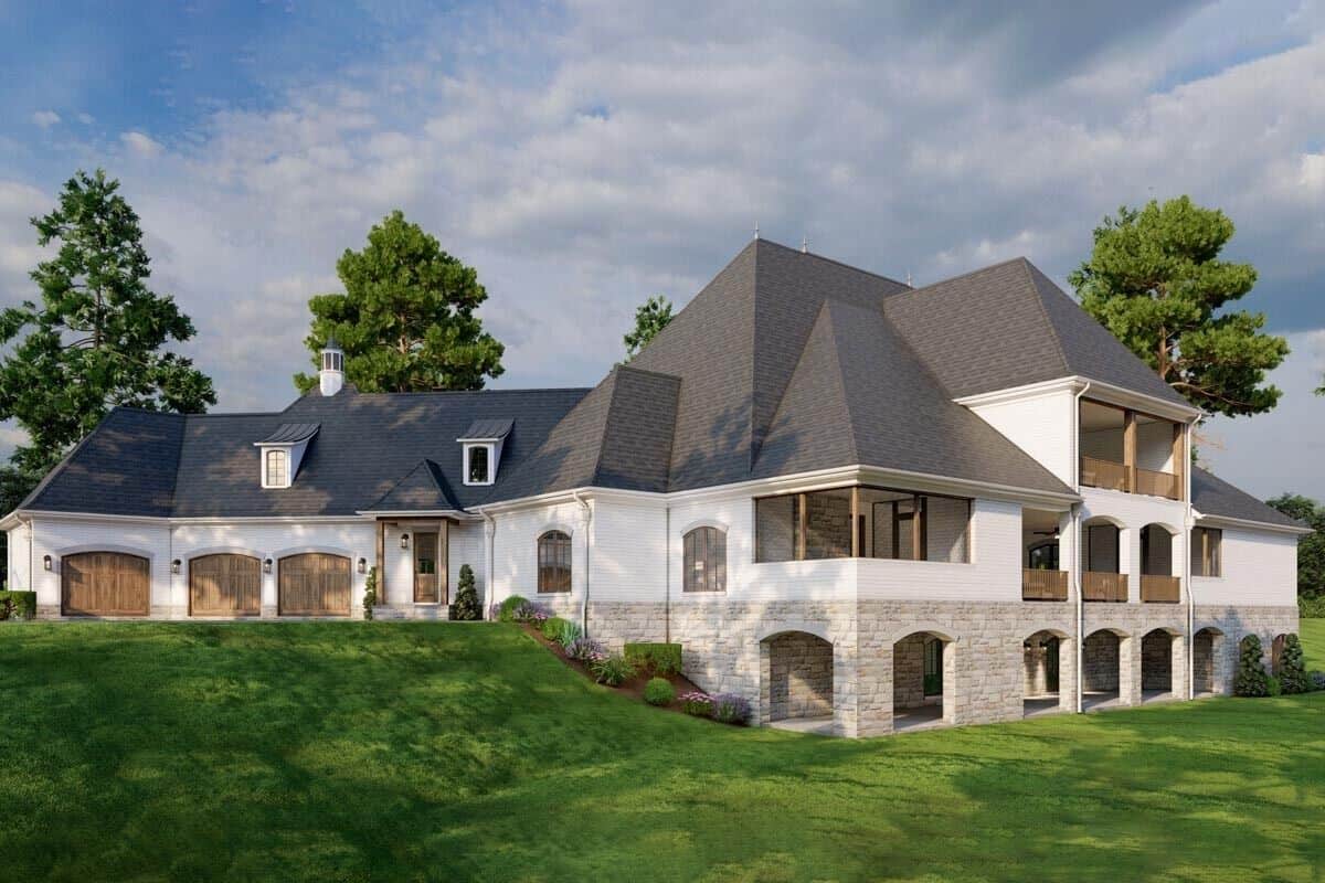 Rear-right view with a walkout basement and an angled 3-car garage.
