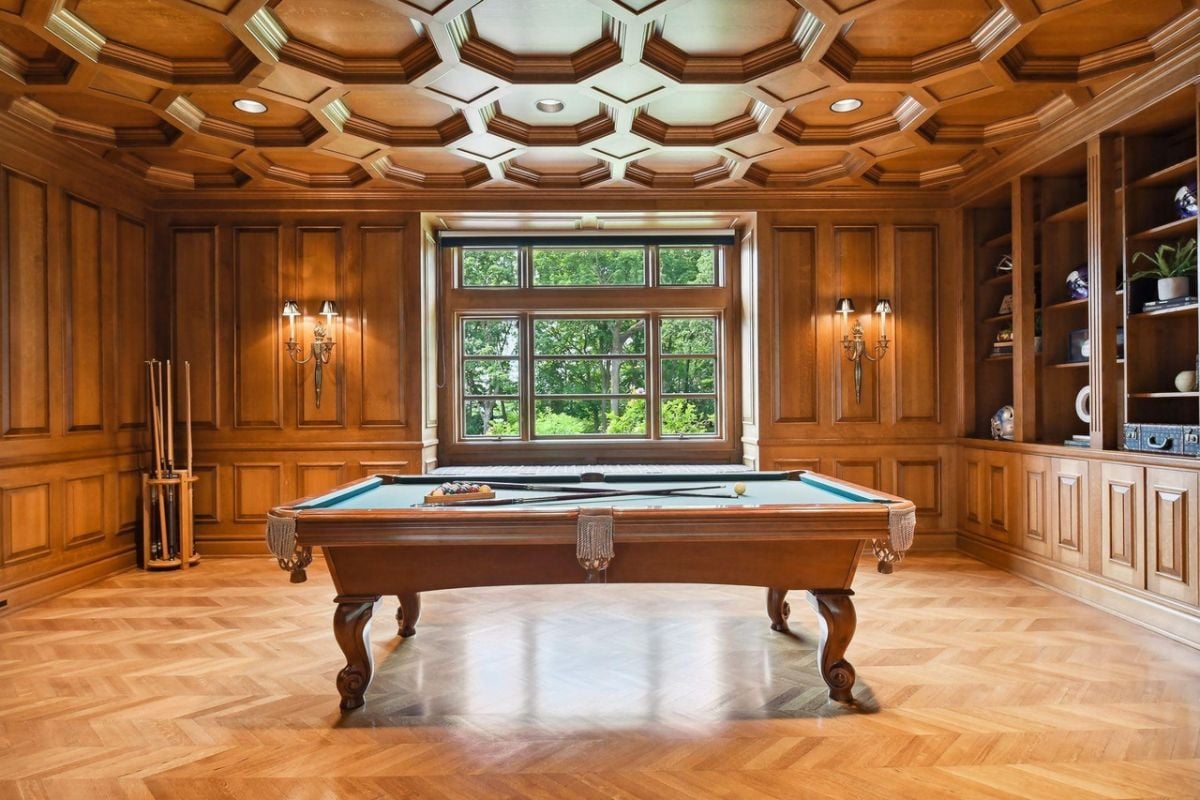 Billiards room with custom wooden cabinet.