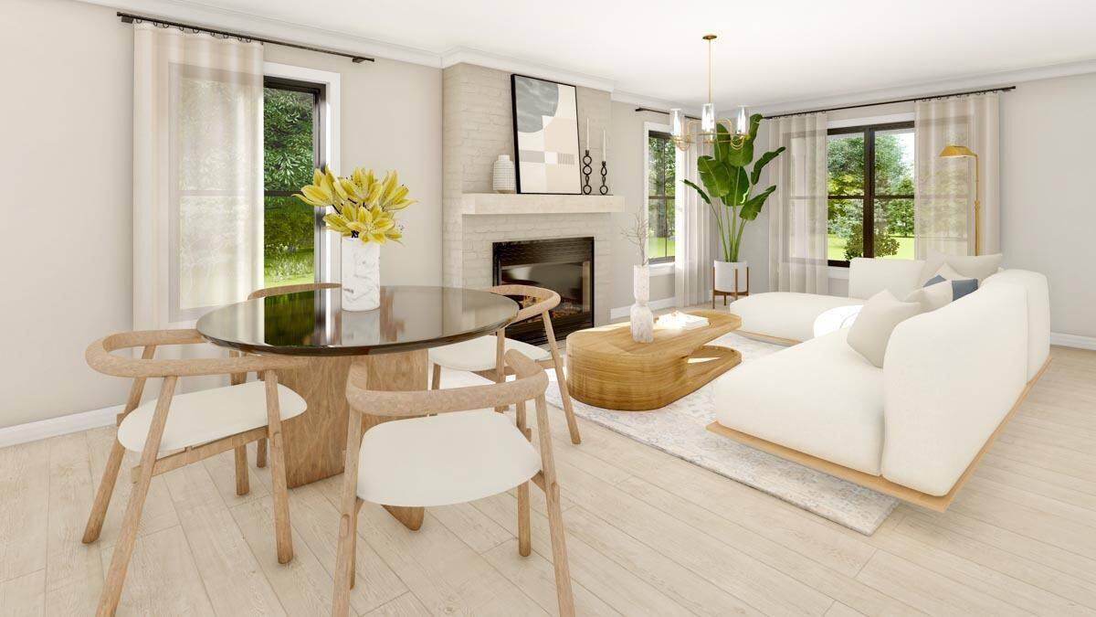 Dining area and living room with a round dining set and a brick fireplace.