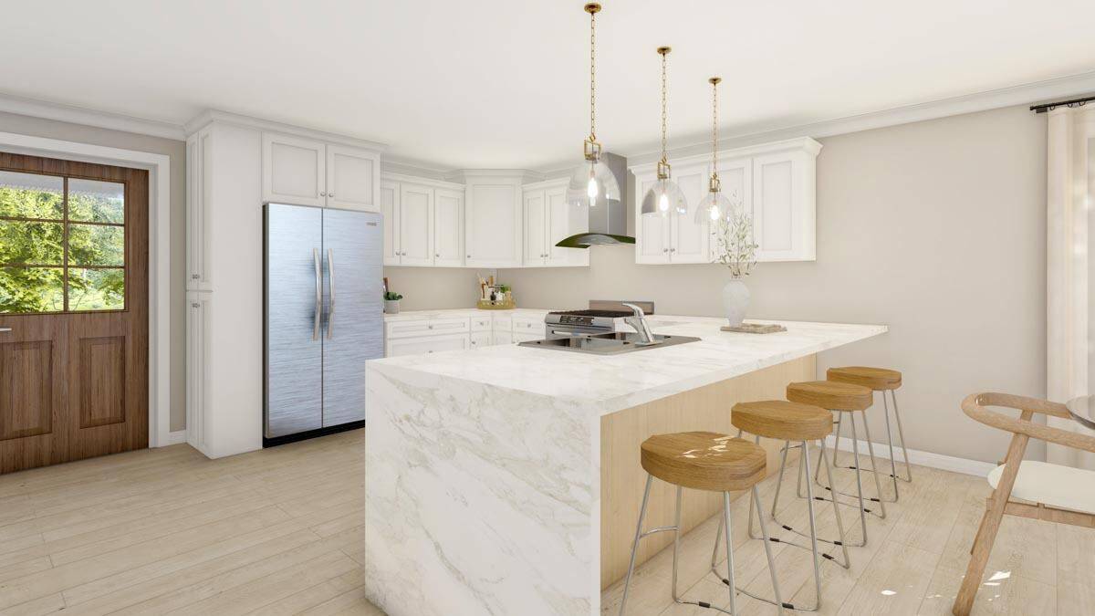 Kitchen with white cabinets, stainless steel appliances, and a peninsula with bar seating.