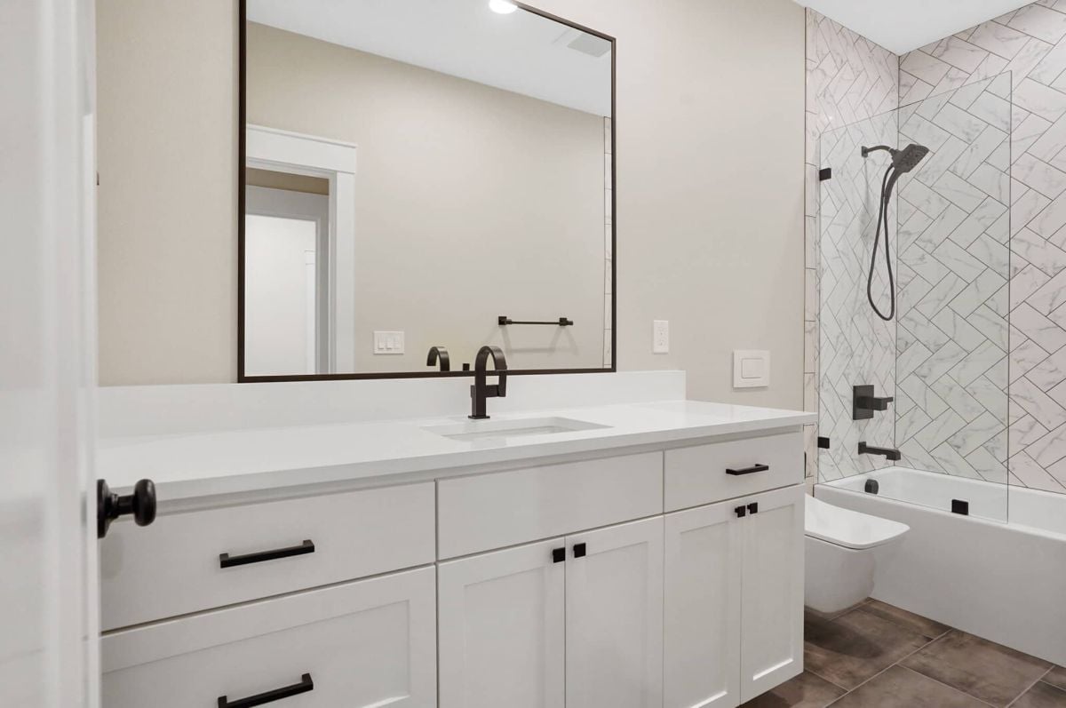 Bathroom with a sink, soaking tub, shower and a toilet.