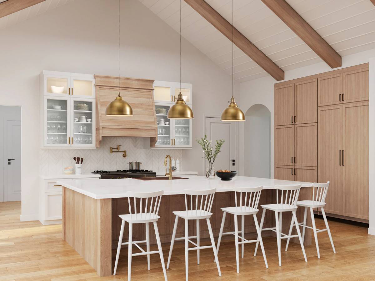 Kitchen with glass-front and wooden cabinets, a breakfast island, and an archway leading to the formal dining room.
