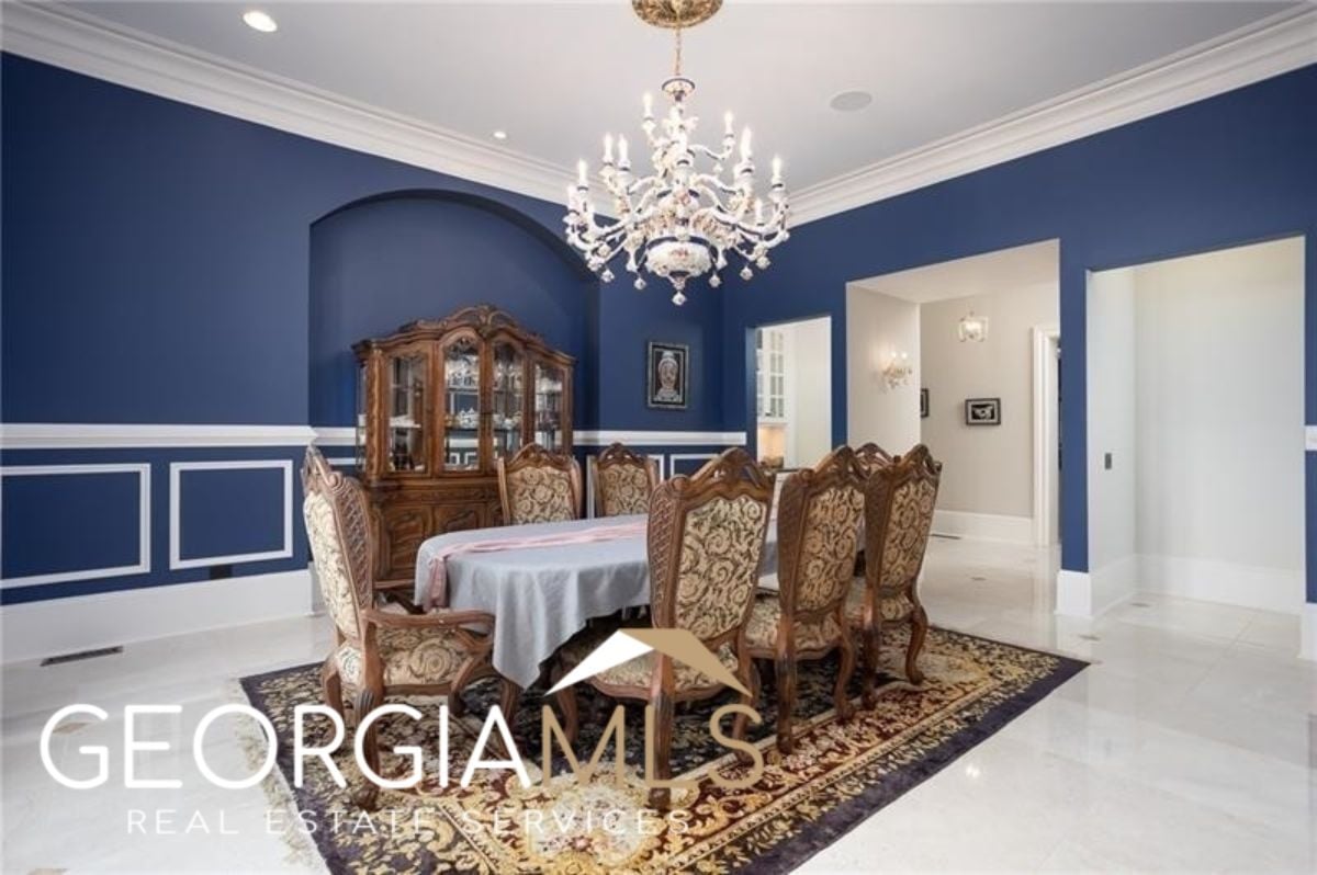 Dining room with a chandelier.