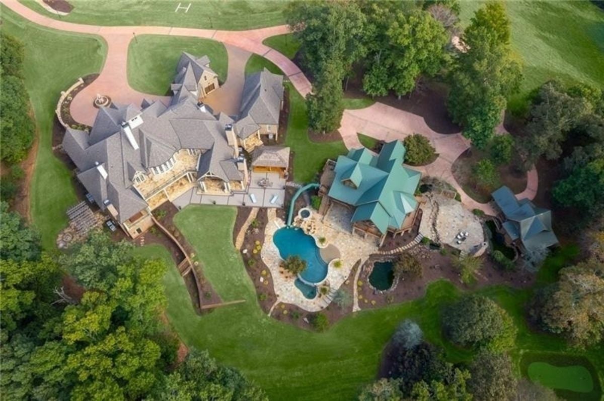 Aerial view of the mansion and the log cabins
