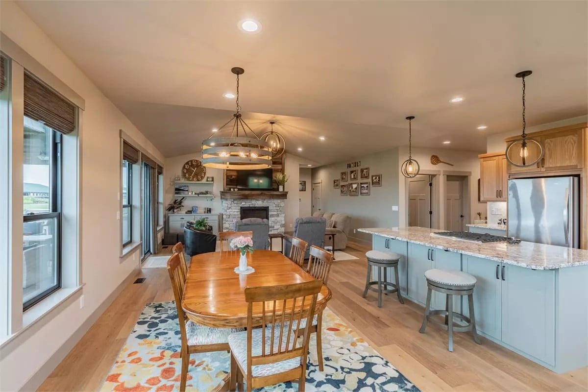An open layout view of the dining area, kitchen, and great room.