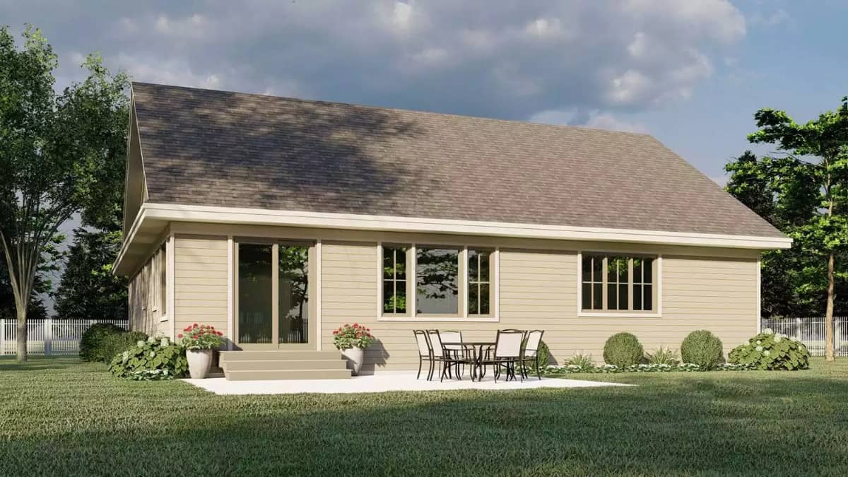 Rear view of the house with sliding glass doors and an open patio.