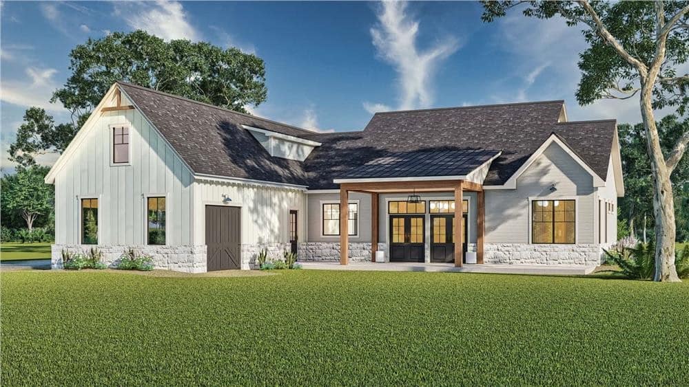 Rear view with a 3-car garage and a covered patio.