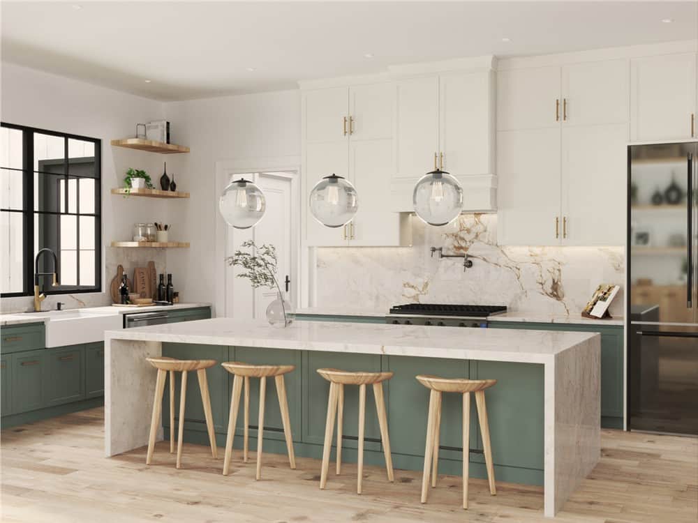Kitchen with white and sage green cabinets, marble countertops, and a breakfast island paired with wooden bar stools.