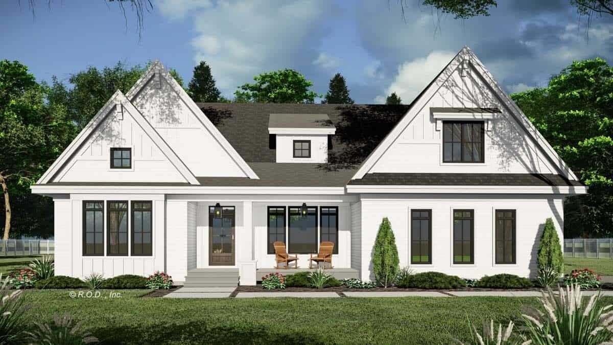 Front view of the house with gable rooflines and a covered entry porch topped with a dormer window.