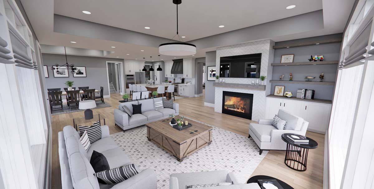 Great room with modern sofas, a rustic coffee table, and a fireplace topped with a TV.