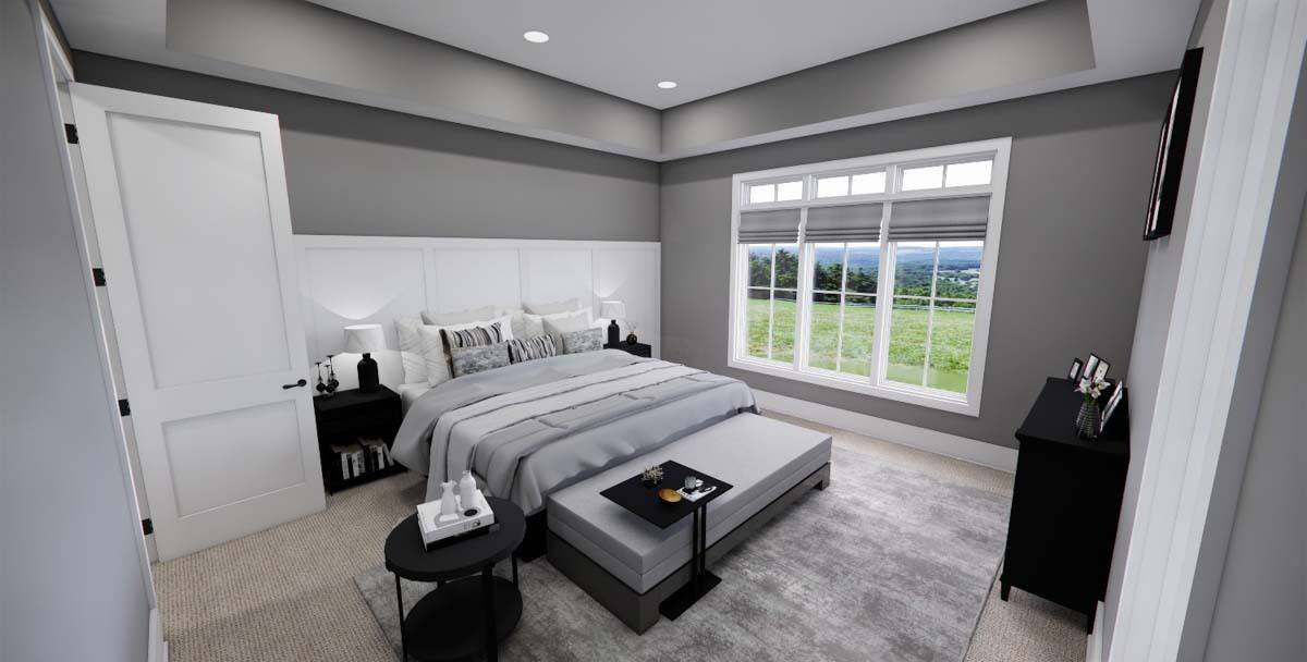 Primary bedroom with a tray ceiling and a dark wood bed with a storage bench on its end.