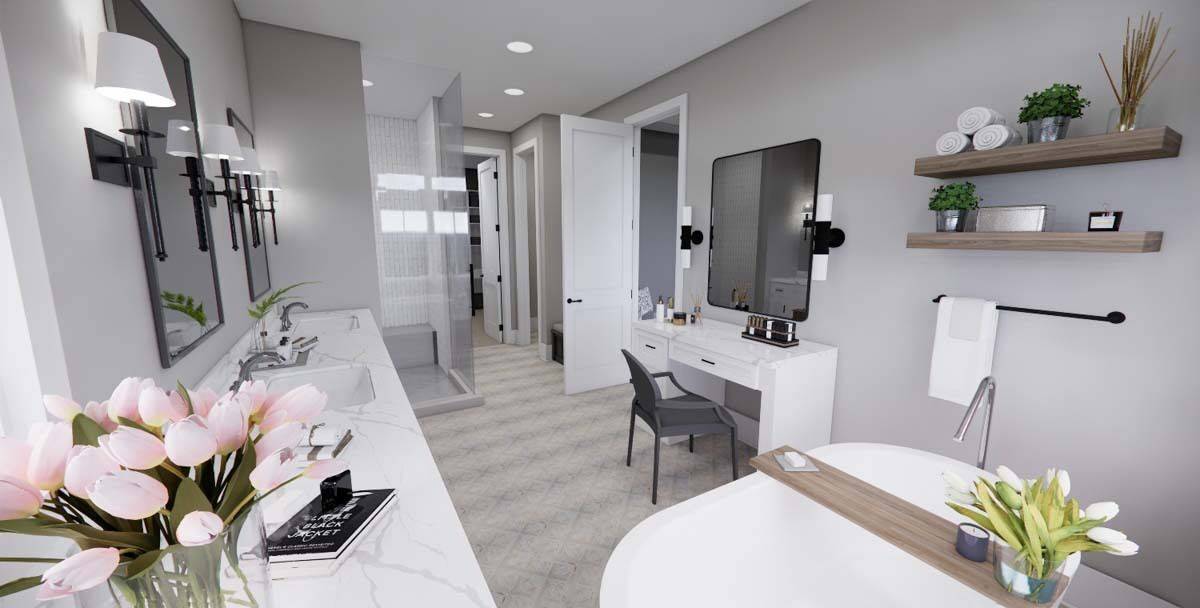 Primary bathroom with a large vanity, a makeup counter, and a soaking tub.