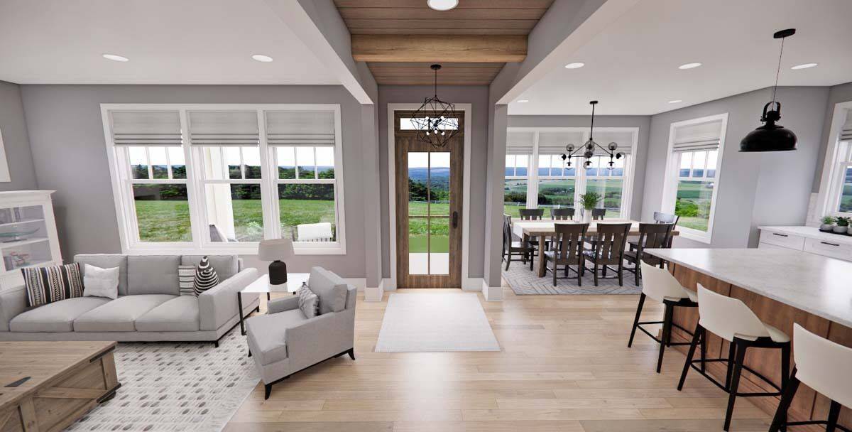 Foyer with a glazed entry door and a wood-paneled ceiling accentuated with exposed beams.