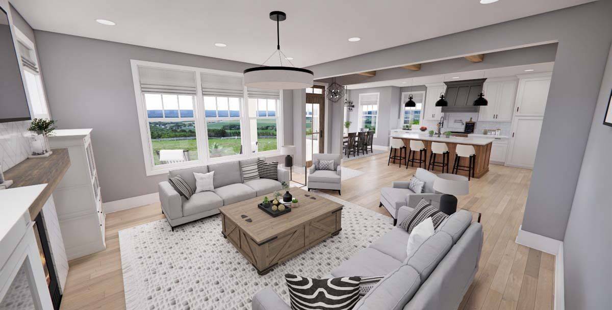Great room with facing sectionals and a wooden coffee table over a patterned area rug.