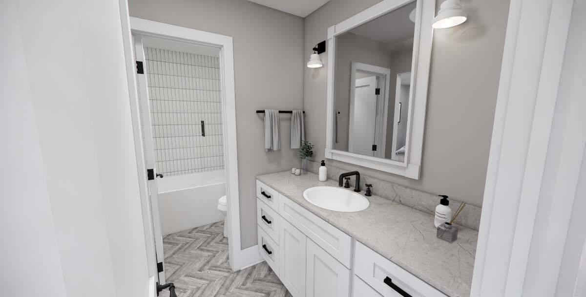 Bathroom with a sink vanity and a separate tub and shower combo.