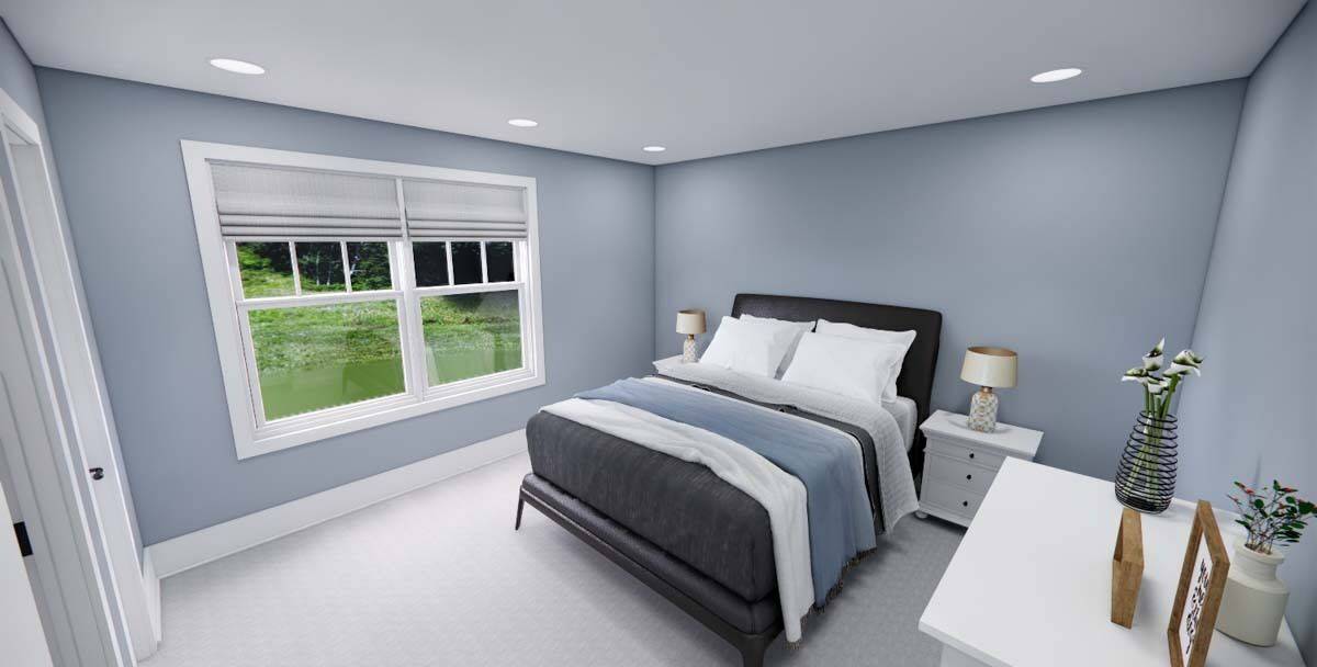 Secondary bedroom with light blue walls and a leather upholstered bed flanked by white nightstands.