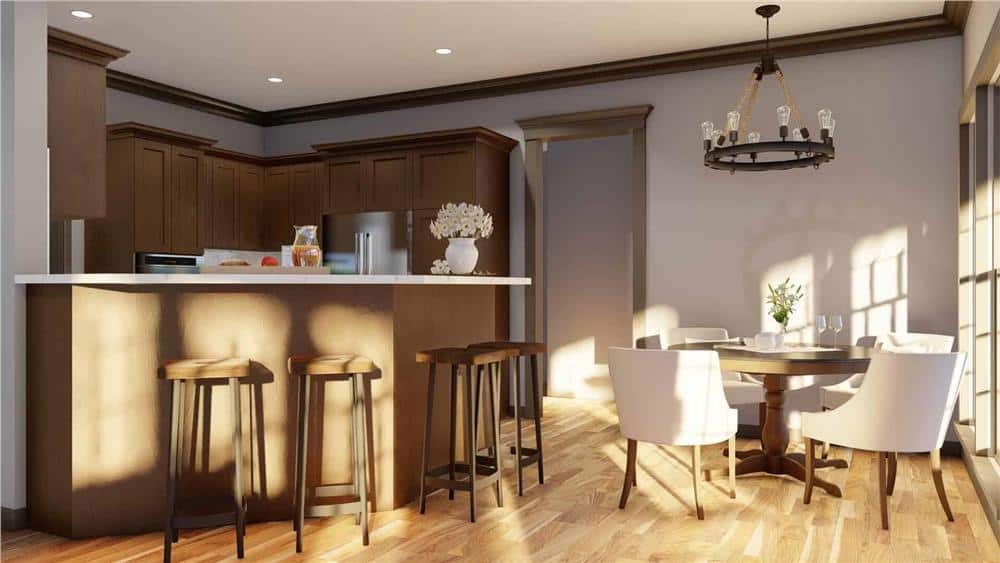 Kitchen and breakfast nook with white walls and hardwood flooring.