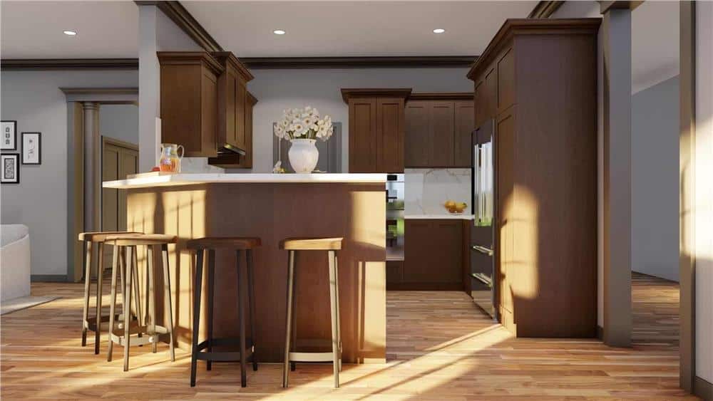 Kitchen with wooden cabinetry, marble counters, and a peninsula bar paired with wooden bar stools.
