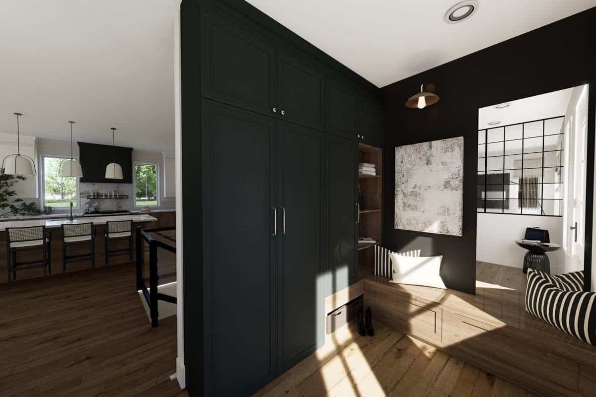 Foyer with built-in cabinets and a storage bench.