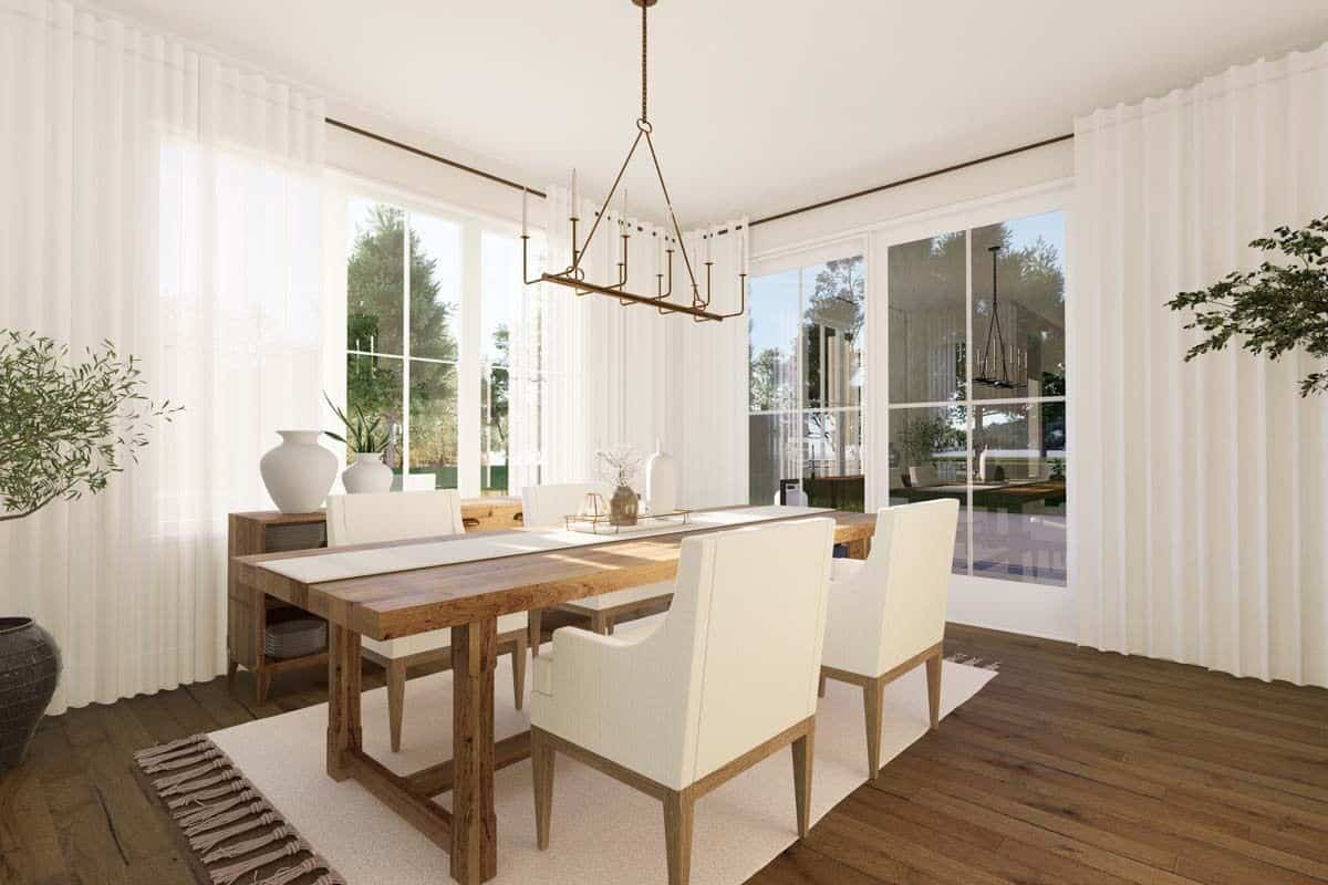 Dining room with a wooden buffet table and a matching dining set sitting on a tasseled area rug.