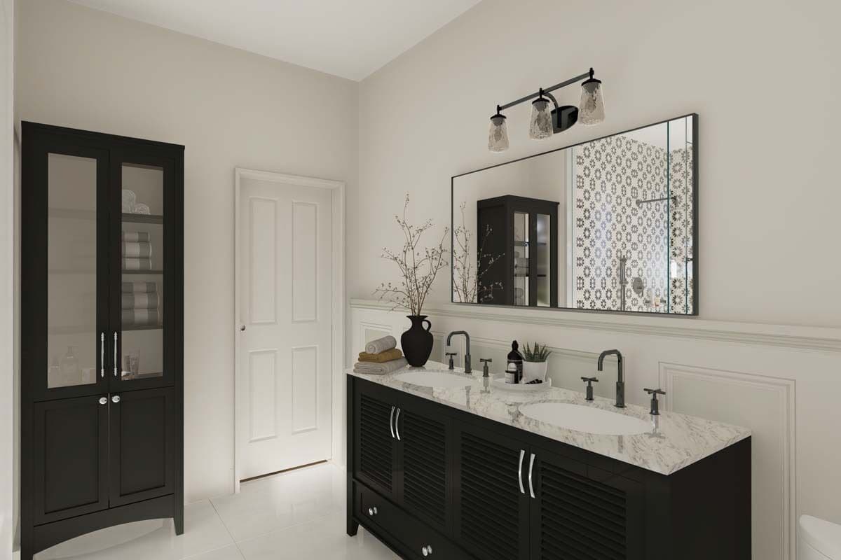 Primary vanity with two sinks, a marble counter, and a rectangular mirror.