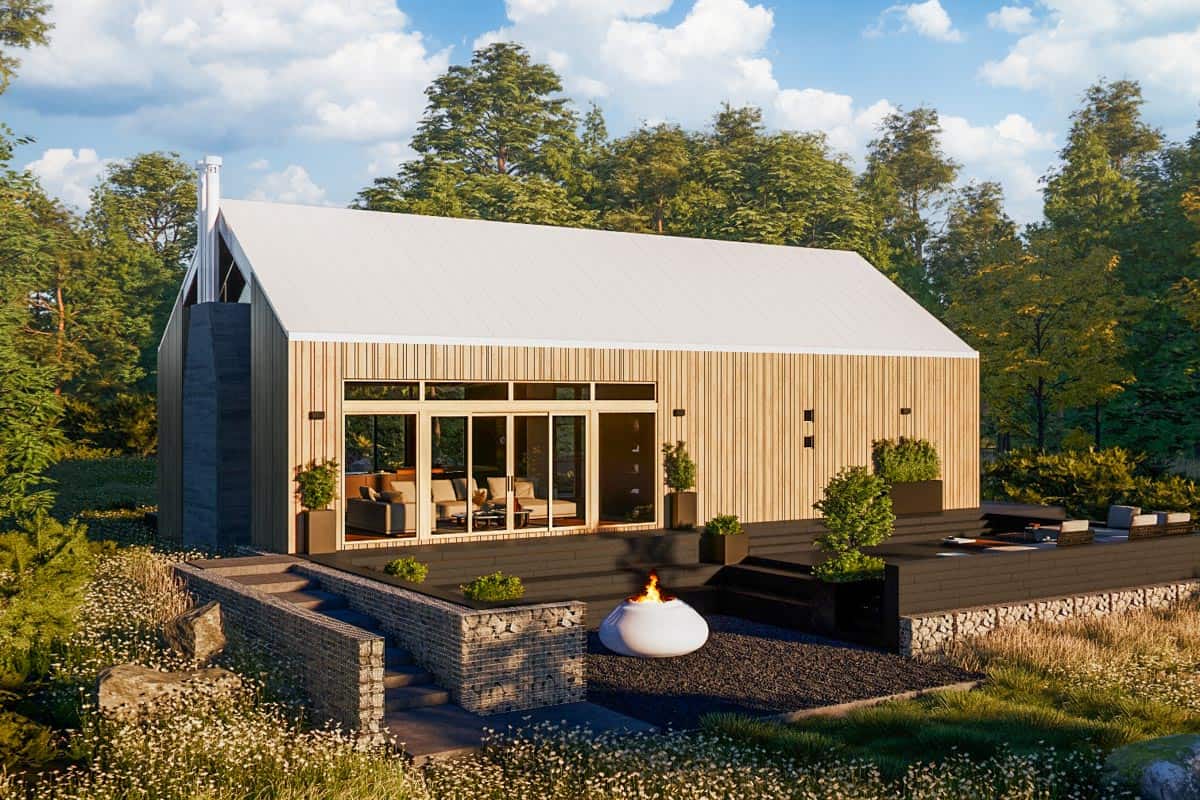Rear view of the house with sliding glass doors and an expansive deck.
