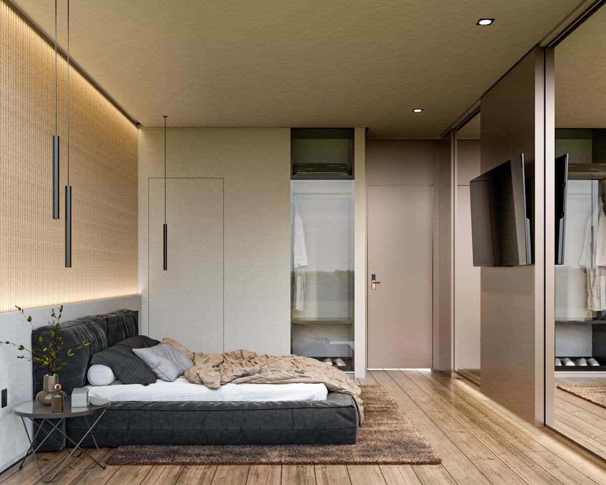 Primary bedroom with built-in wardrobe, a platform bed, and a wall-mounted TV.