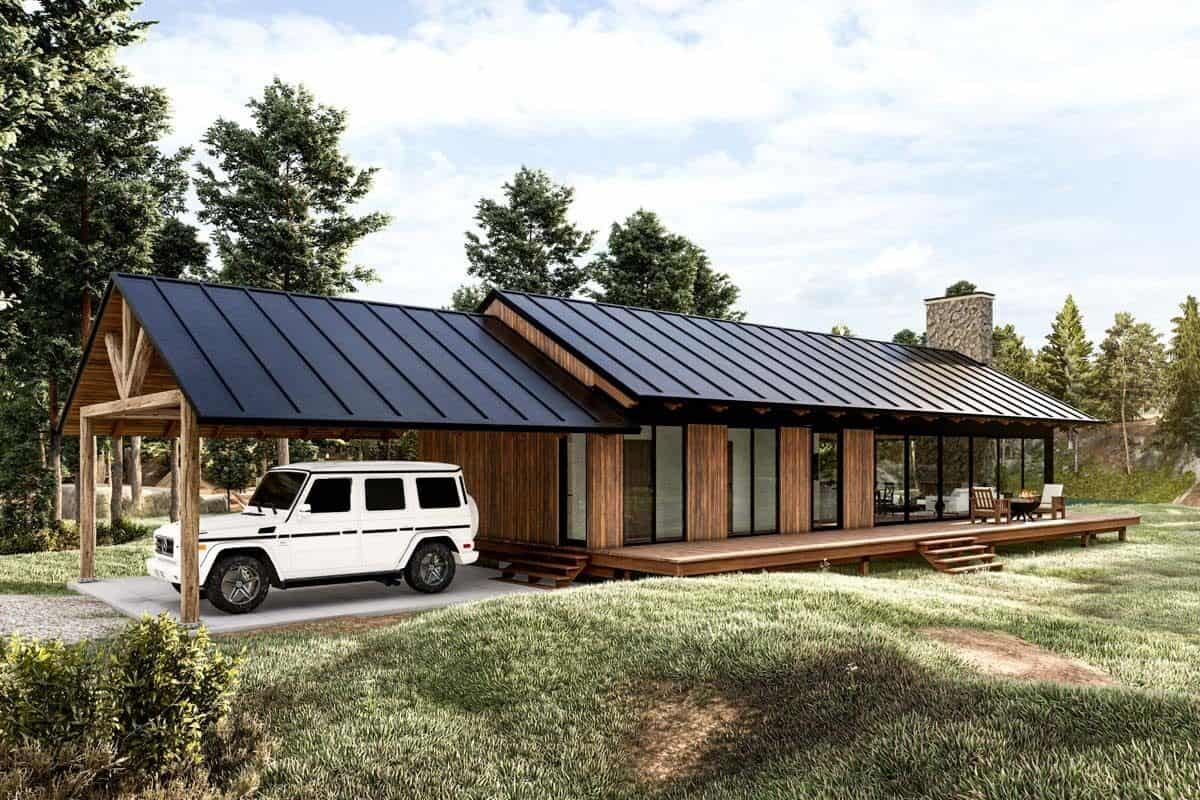 Front-left view of the house with an expansive deck and a carport.