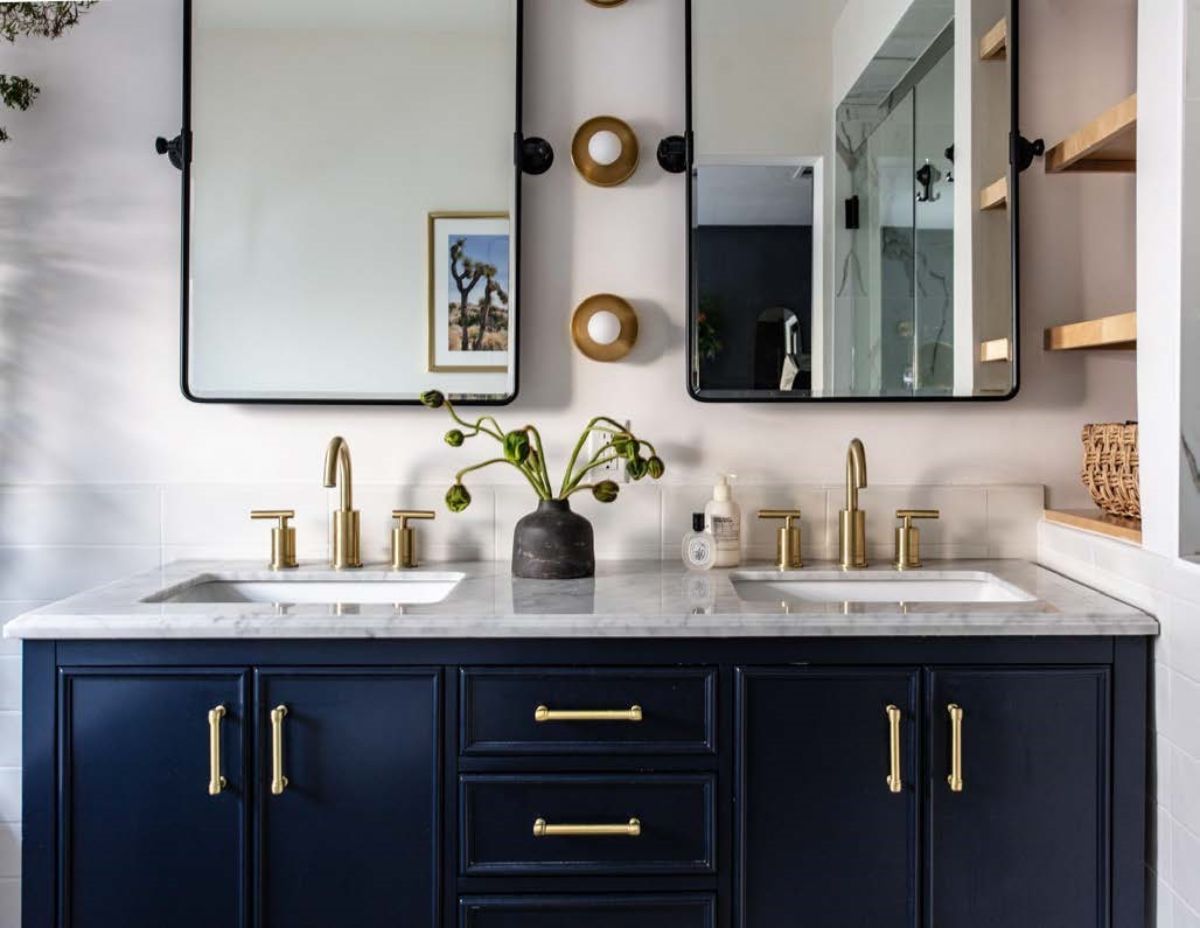Bathroom with dual sink and mirrors.