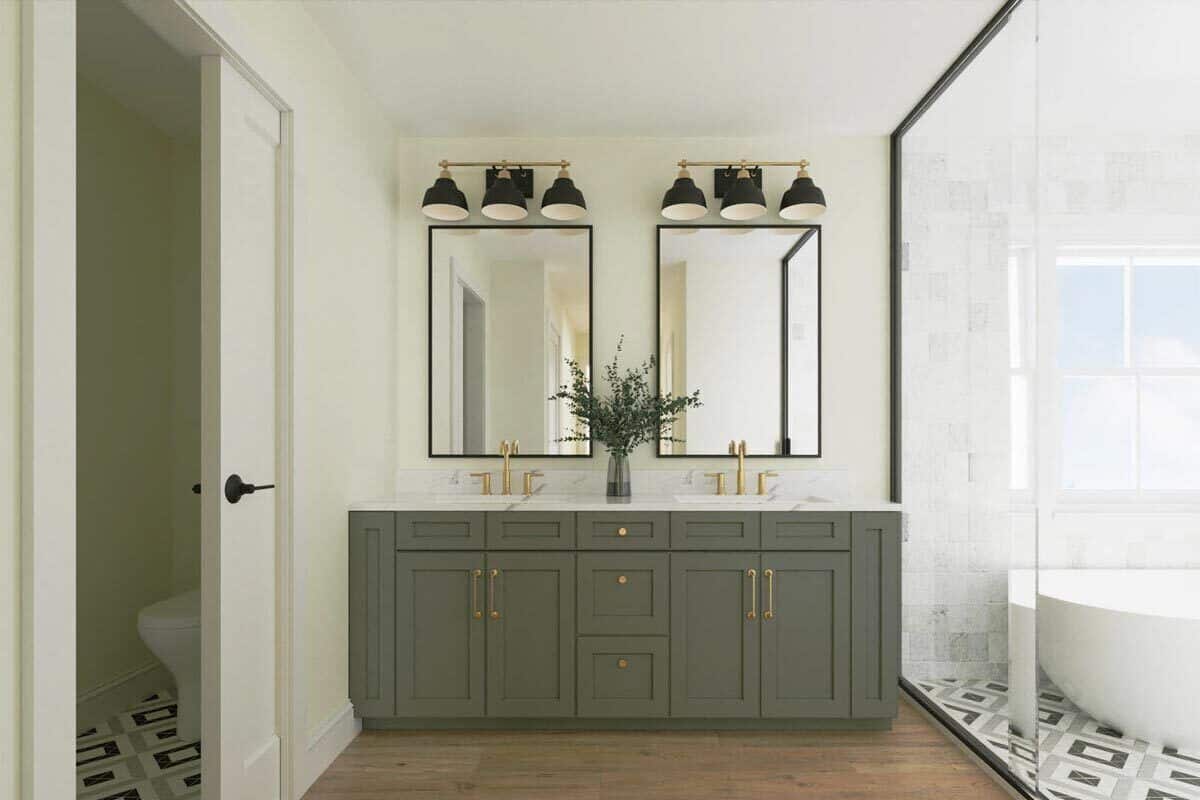 Primary vanity with two sinks, gray cabinets, and framed mirrors.