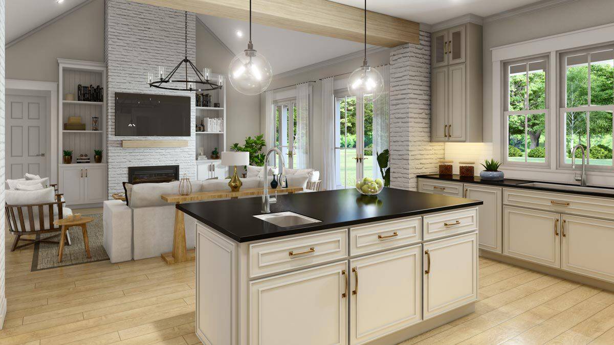 Kitchen island with a prep sink overlooking the great room.
