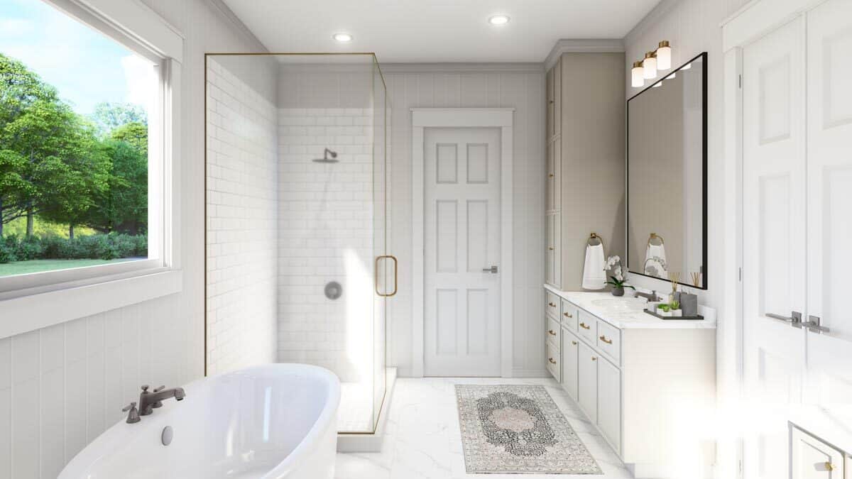 Primary bathroom with a sink vanity, a tiled shower, and a soaking tub illuminated by a picture window.