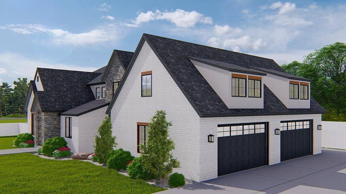Front-right view with a side-loading garage topped with twin shed dormers.