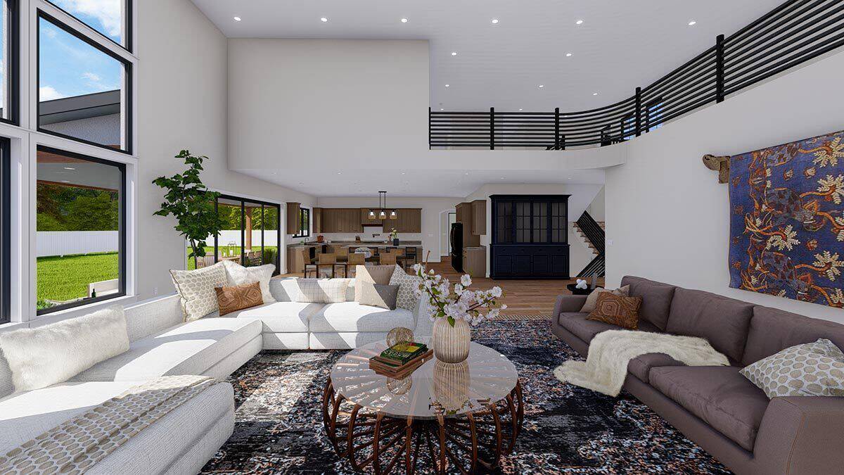 The great room includes sectional sofas and a round coffee table over a vintage area rug.