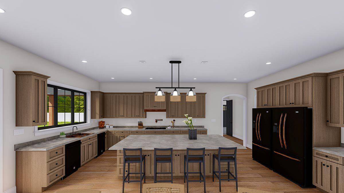 Kitchen with wooden cabinets, black appliances, and a center island with seating for four.