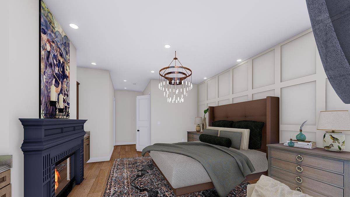 Primary bedroom with a fireplace and a wingback bed against the paneled accent wall.