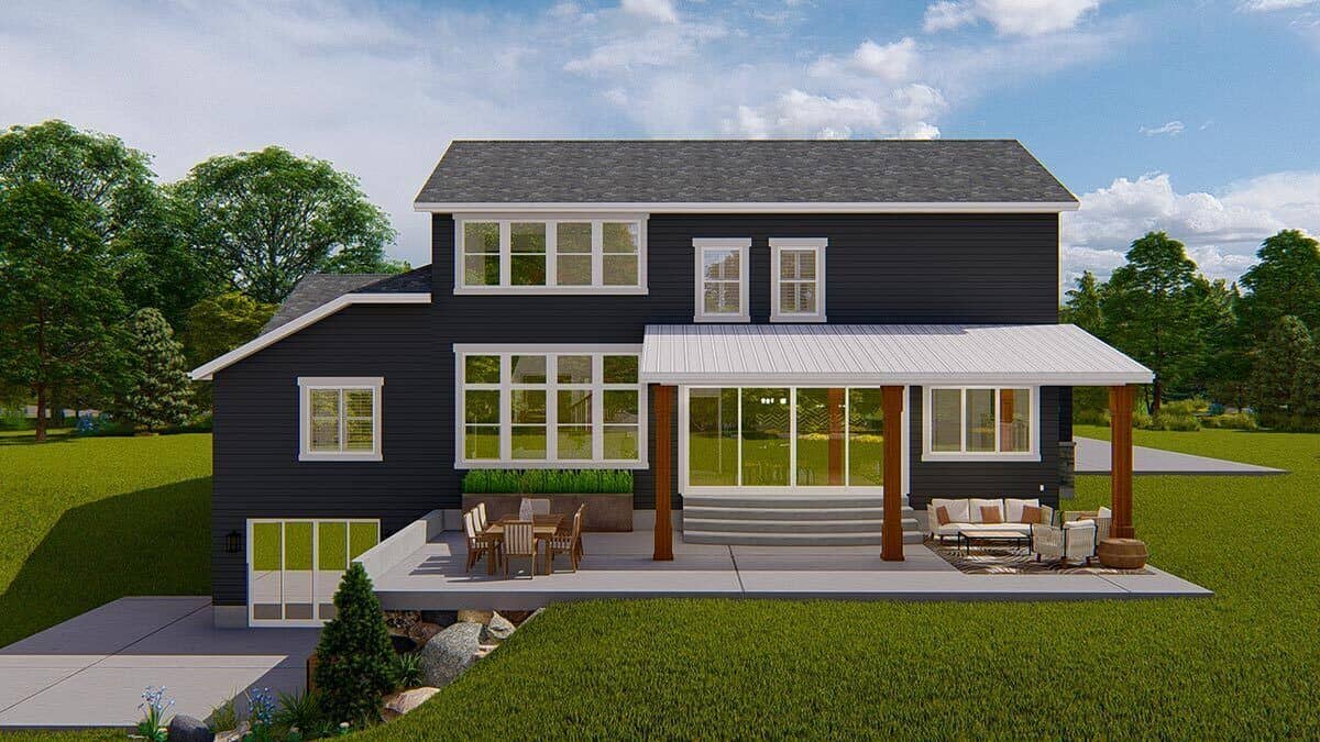 Rear view with a covered patio, sliding glass doors, and a multitude of windows.