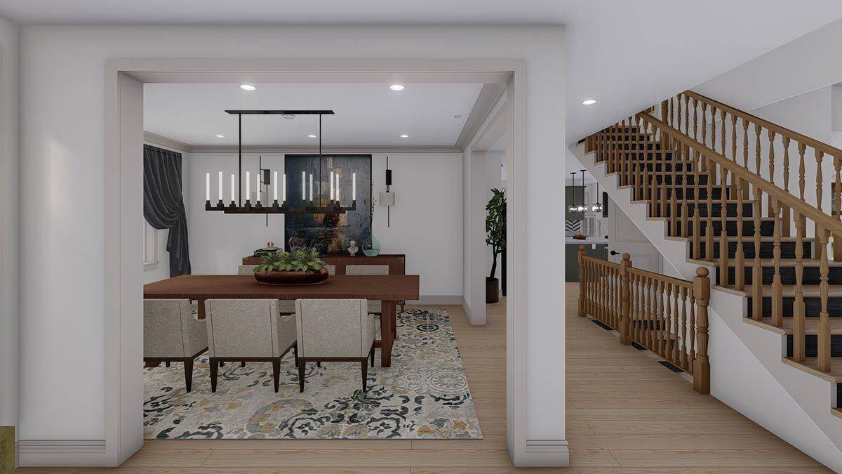 Dining room with a wooden dining set over a floral area rug.