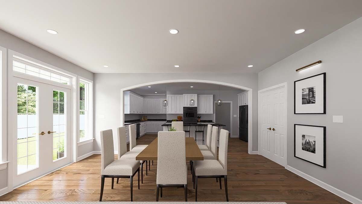 Dining room with a wooden table, high back chairs, and a French door that opens to a covered porch.