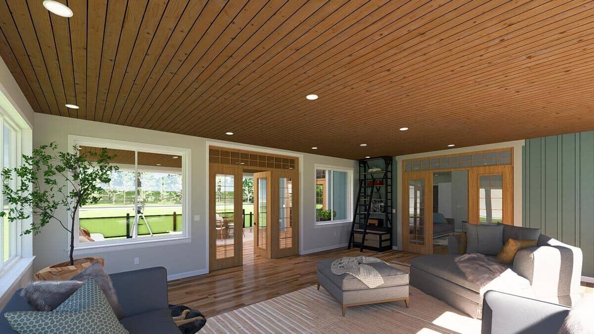 The sunroom connects to a deck and great room through French doors.