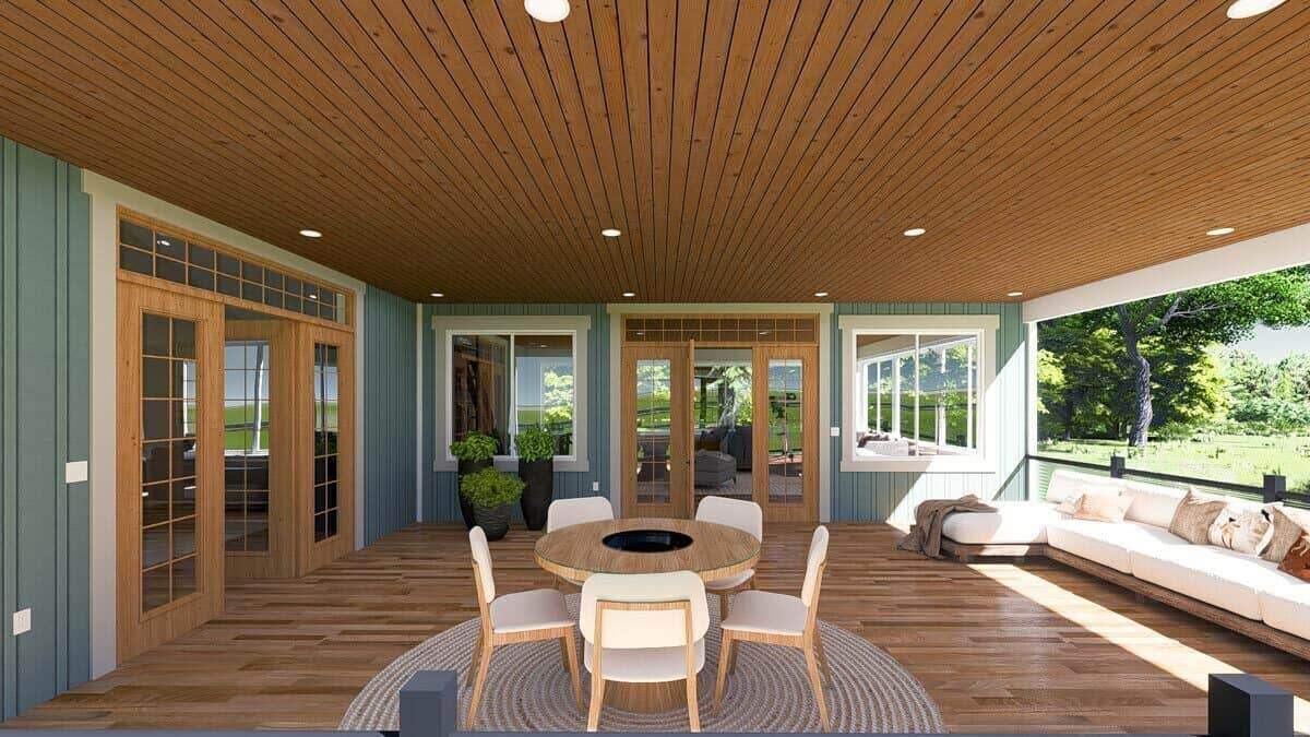 The covered deck connects to the dining room and sunroom through French doors.