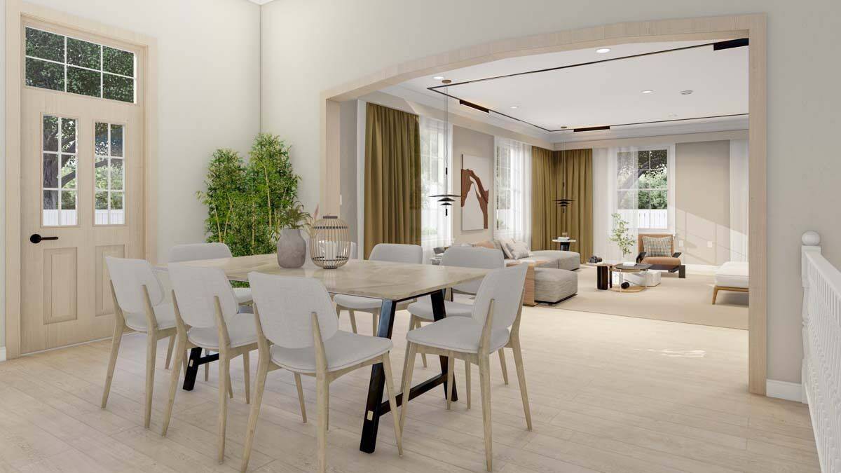 Dining area with a upholstered chairs and a light wood table that blends in with the hardwood floor.