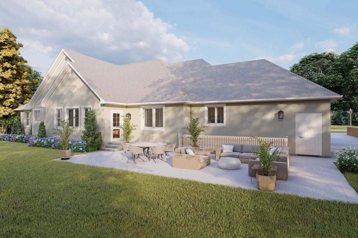 Rear view of the house showcasing the spacious patio with outdoor living and dining.