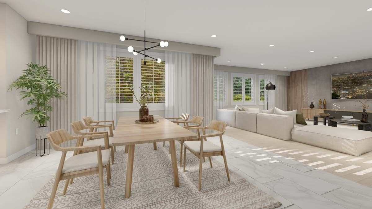 Dining area with a wooden dining table and matching chairs over the area rug.
