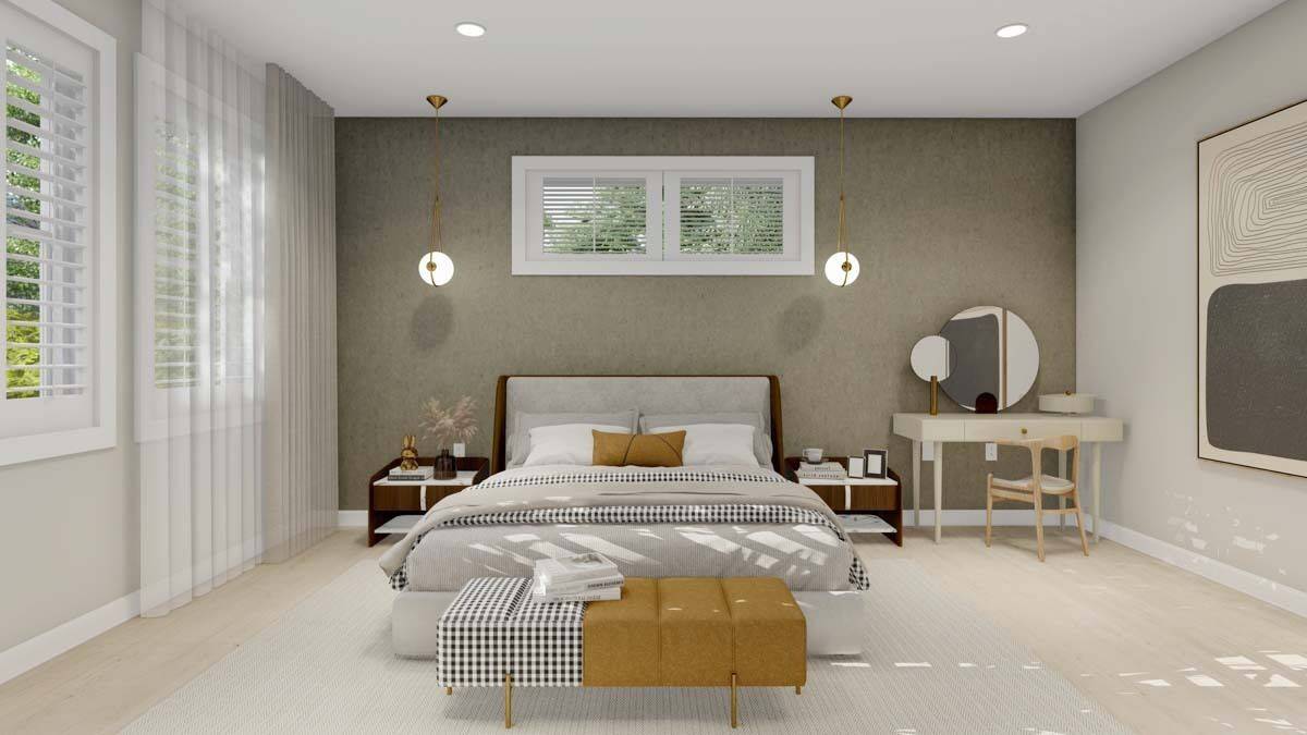 Primary bedroom with a light wood dresser and a platform bed complemented with a contemporary bench.