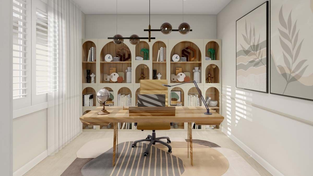 Home office with a wooden desk and a wall of built-ins with arched shelves.