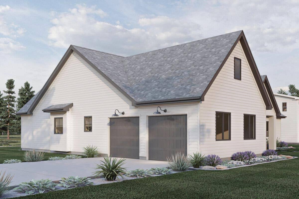 Right view of the house showcasing the double garage and concrete driveway.
