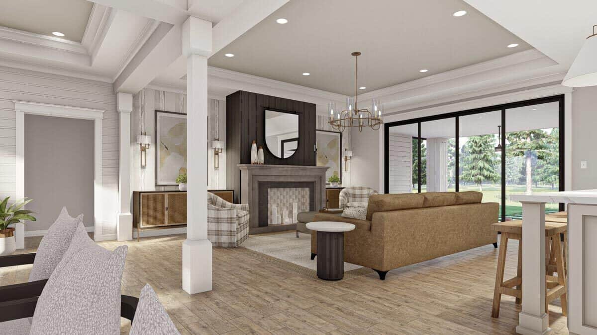 Great room with a sectional sofa and sliding glass doors that open to a covered patio.