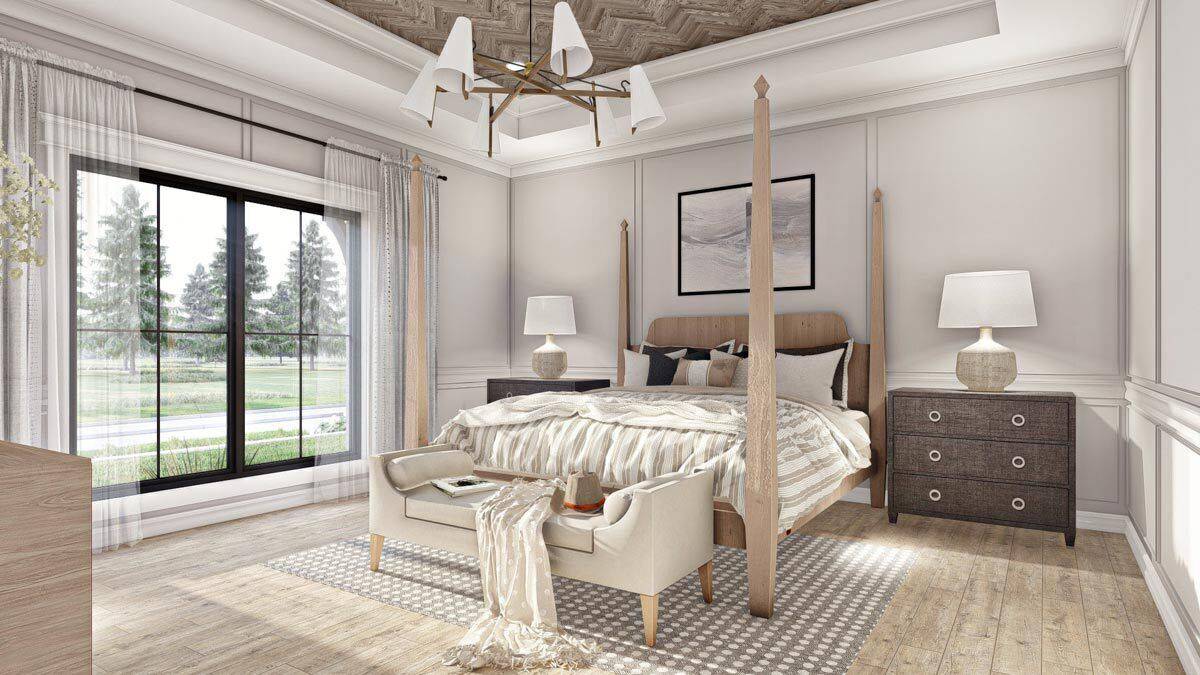 Primary bedroom with a decorative tray ceiling and a four-poster bed complemented with an upholstered bench.