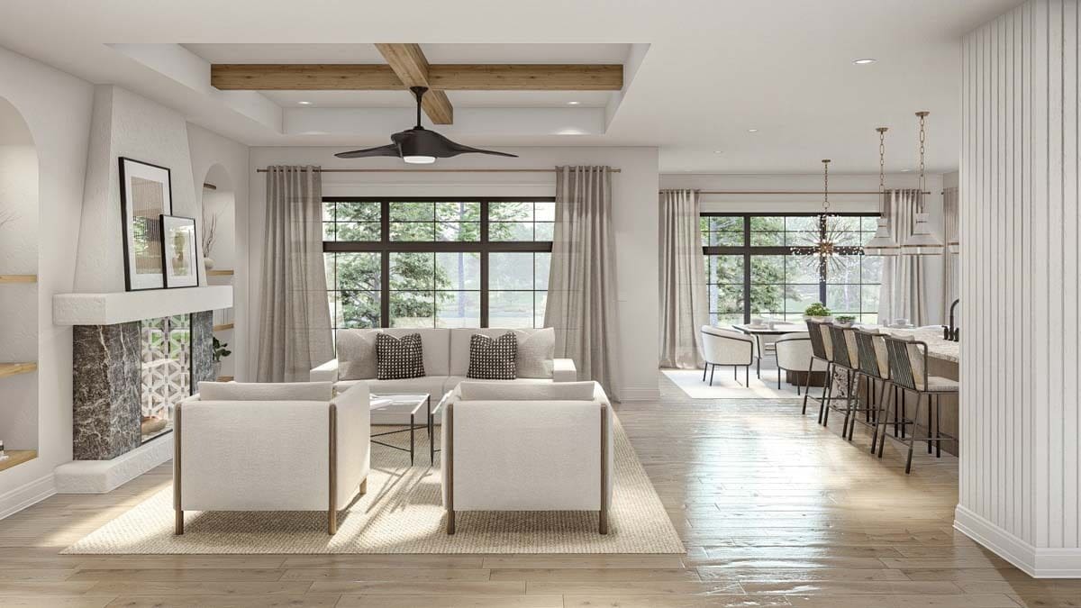 An open layout view of the great room, kitchen, and dining area from the foyer.